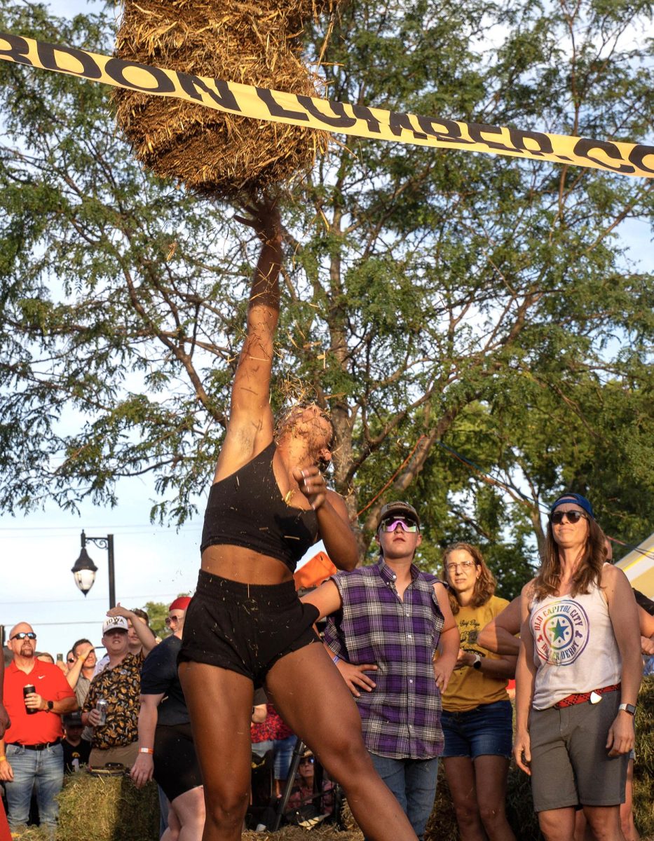 Ali Dorn tosses a bale over the bar in the 2024 Solon Beef Days Hay Bale Toss. This year’s competition is set for Friday, July 18 on Main Street.