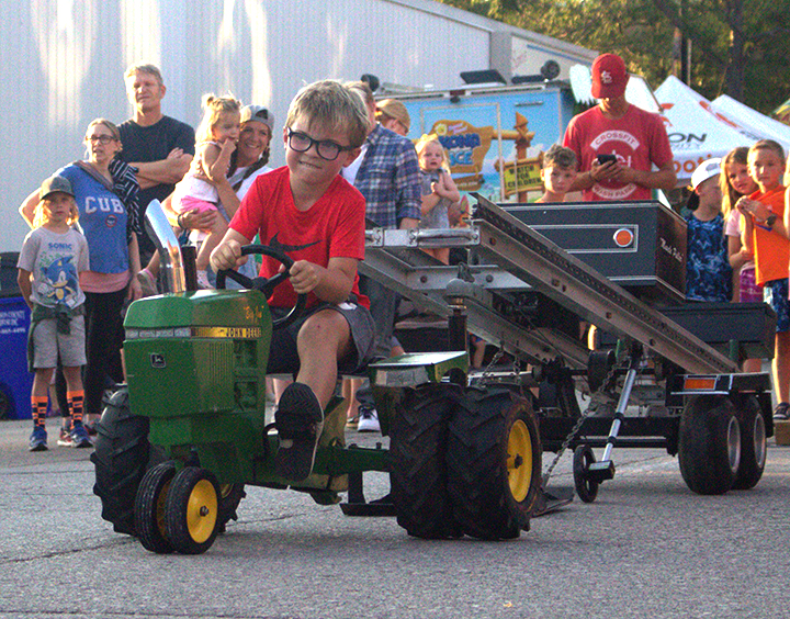 Maddox Stormer, of Solon, chugs along steadily as he competes in the 51–55 lb. group in the Kid’s Tractor Pull Friday, July 18, during Solon Beef Days.
