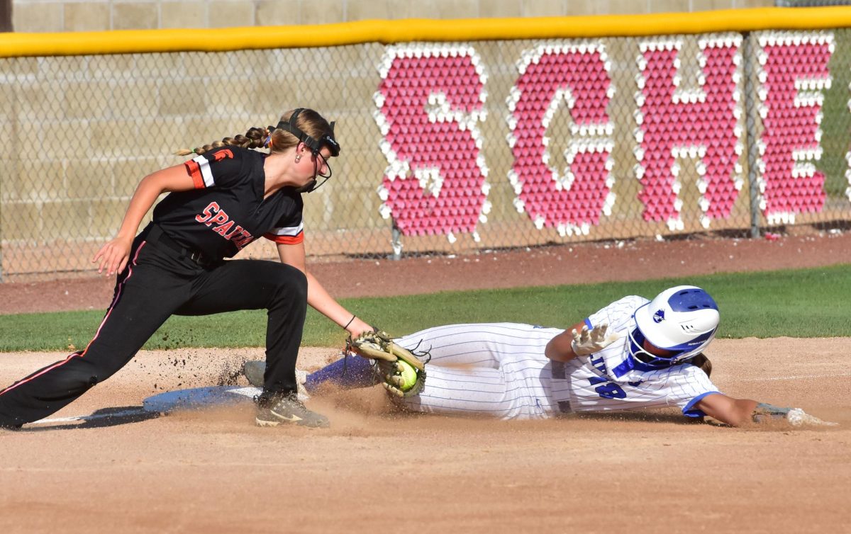 Freshman Liv Nelson tries to tag out CCA’s Elizabeth Timmerman in game one of a varsity doubleheader Wednesday, July 2 in Solon. The Clippers swept the Lady Spartans 11-6 and 11-0.