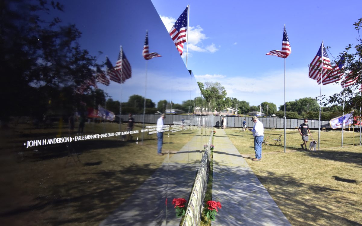 The American flag, and visitors are reflected in the highly polished panels making up The Moving Wall, a half-sized replica of the Vietnam Memorial in Washington, DC. The display, with the names of over 58,000 servicemen and women, was on display in the American Legion Stinocher Post 460’s ball field in August 2021. Next month a similar wall dedicated to the Global War on Terror, from the 1983 bombing of the U.S. Marine barracks in Beirut, Lebanon to the 2021 withdrawal of U.S. forces from Afghanistan will be in Solon at Legion Park.