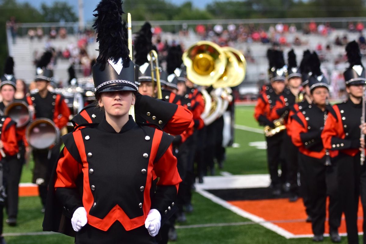 The Solon High School Marching Band exits the field after pregame ceremonies Friday, August 29. The 40-some-member band performed the National Anthem and school fight song to open the first varsity football game of the season and debuted their competition piece for the year during halftime.
