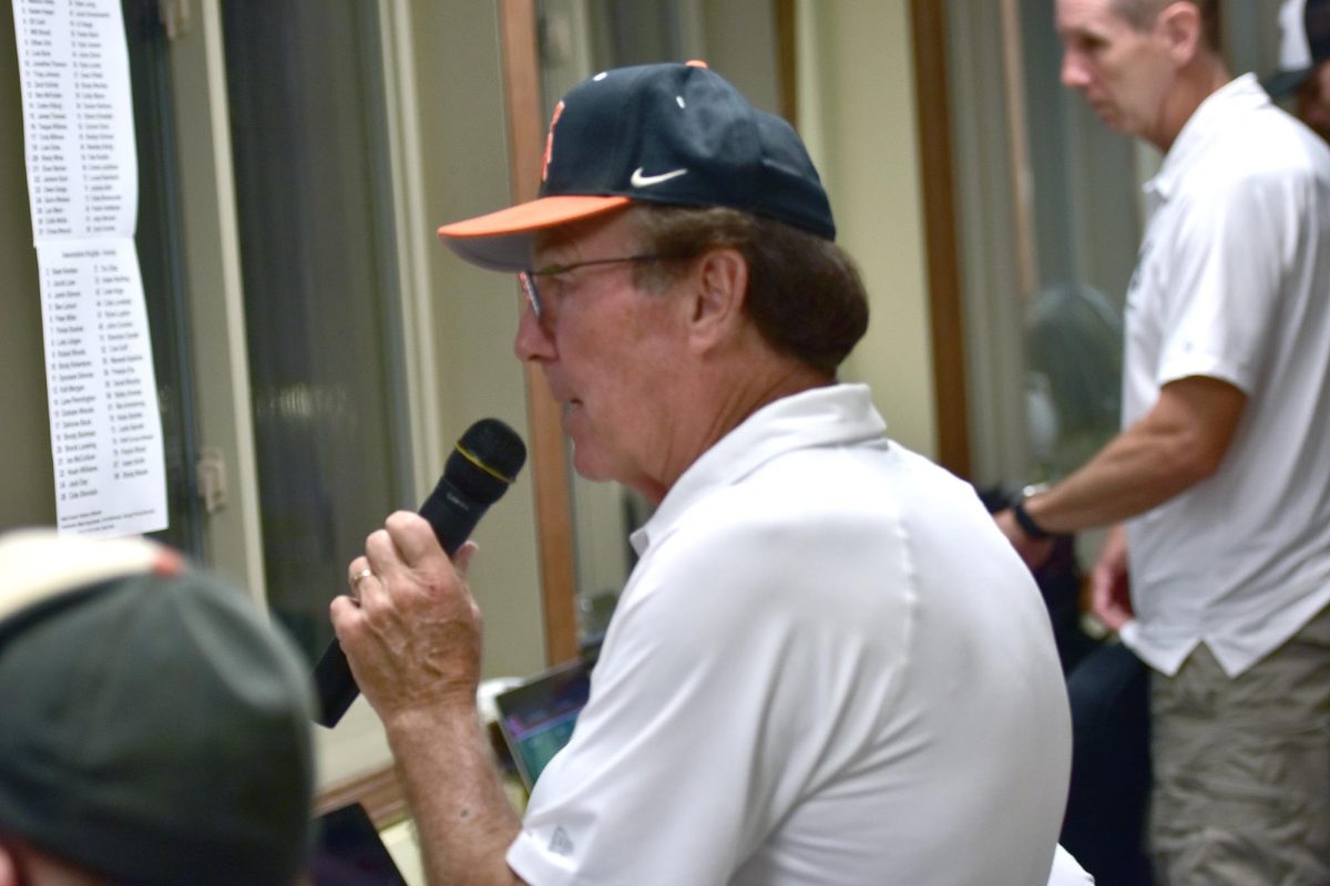 Don Ellis, “The Voice of the Spartans,” announces the end of a lightning delay and that the crowd may reenter Spartan Stadium ahead of the pregame warm ups and ceremony before the opening kick Friday, August 29. Ellis has been the man on the mic since 1988, becoming a Friday night football tradition in Solon.