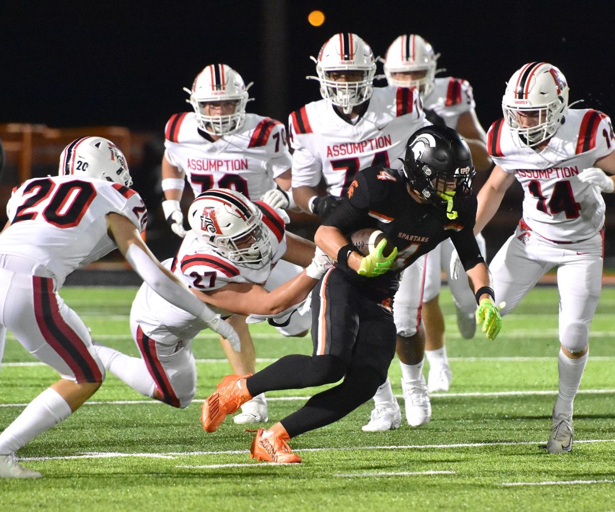 Maddox Kelley (4) was very (un)popular with the Assumption Catholic HS Knights Friday, August 29 in the season opening game. Kelley took nine passes 84 yards for three touchdowns in a 36-13 Spartan win.