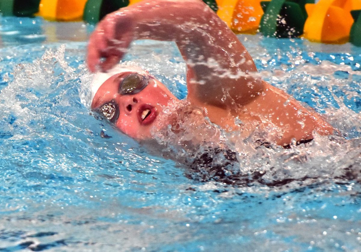 Avery Feuerbach, a freshman, won the JV 100-yard backstroke, took 2nd in the JV 200 IM (shown here), and swam the first leg of the 2nd place JV 200 freestyle relay in Iowa City High’s season opening meet Tuesday, August 26 at Kennedy HS in Cedar Rapids.