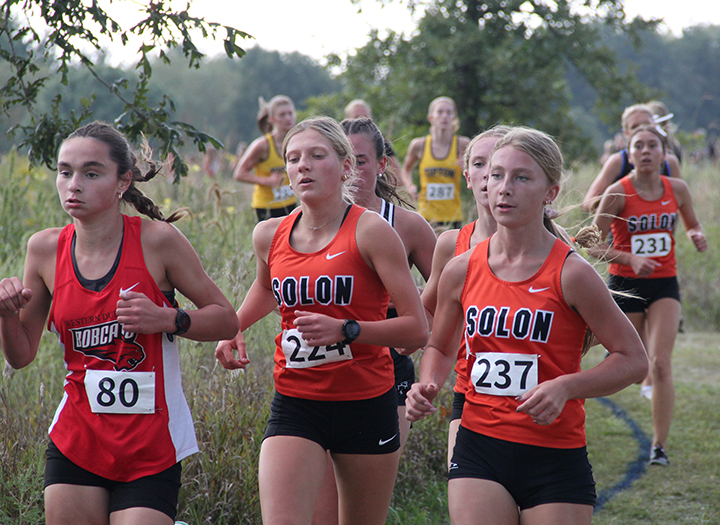 Junior Falyn Svalstad sets the pace for a pack of Spartans, helping secure the team victory at the Bob Brown Cross Country Classic Thursday, Sept. 4, at the Iowa City Kickers Soccer Complex. Svalstad finished sixth in 20:48.7.