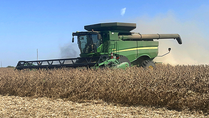 Matt and Holly Poduska combine soybeans on the family farm near Solon.