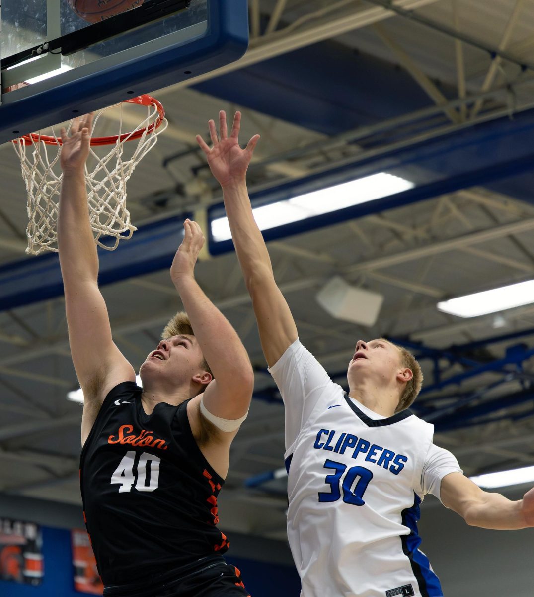 Solon Center Tanner Heim goes in for the layup during a game between the Solon Spartans and Clear Creek Amana Clippers at Clear Creek Amana High School in Tiffin Friday, Dec. 5. Heim scored seven points during the game.