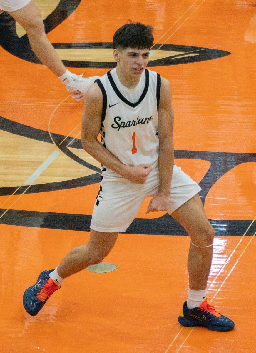 Junior Tate McCollum (1) celebrates after a big play at midcourt during the Spartans’ matchup against Mount Vernon on Tuesday, December 16, 2025, at Solon High School.