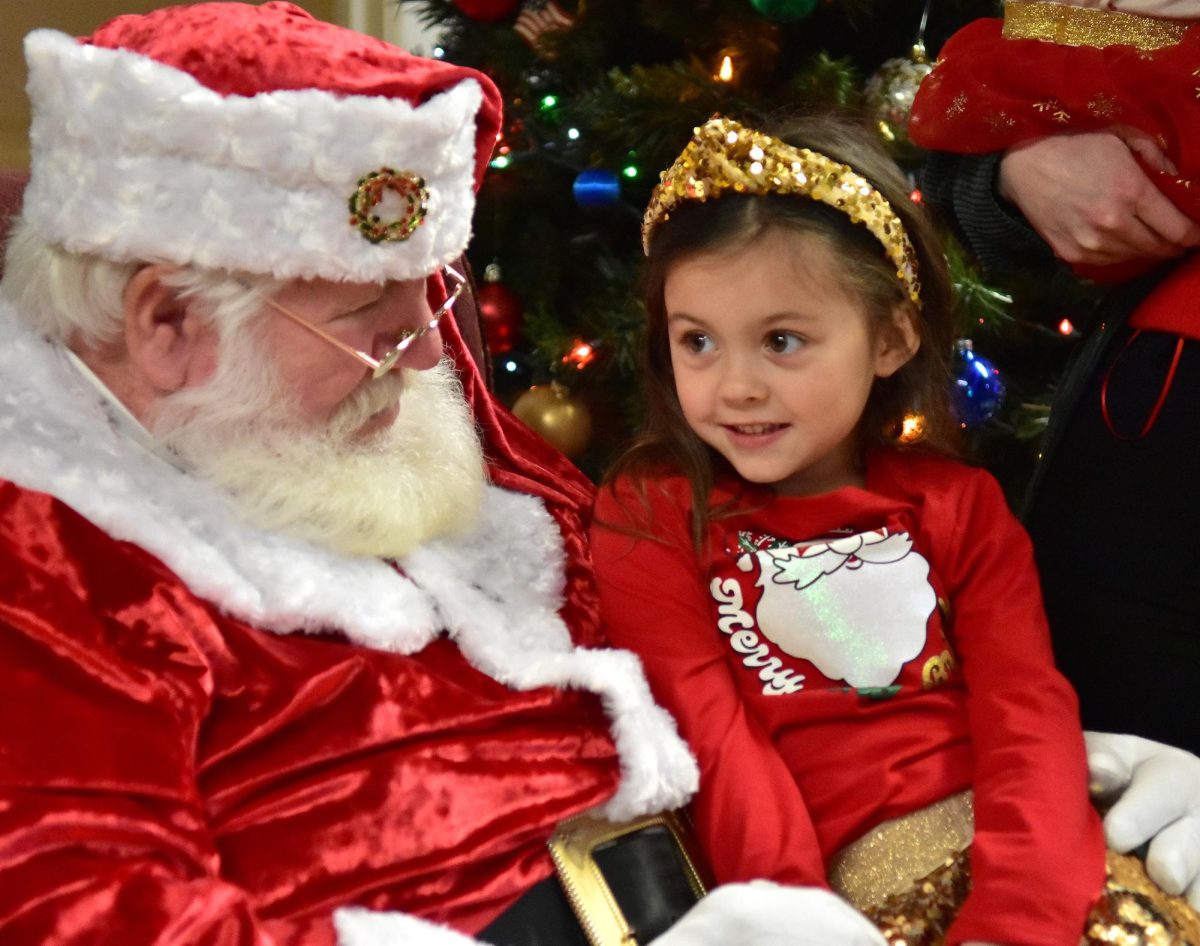 Marlee Slocum enthusiastically chats with Santa Claus during his 2023 visit to the Solon American Legion. Mr. Claus returns this Saturday morning at 11:00 a.m.