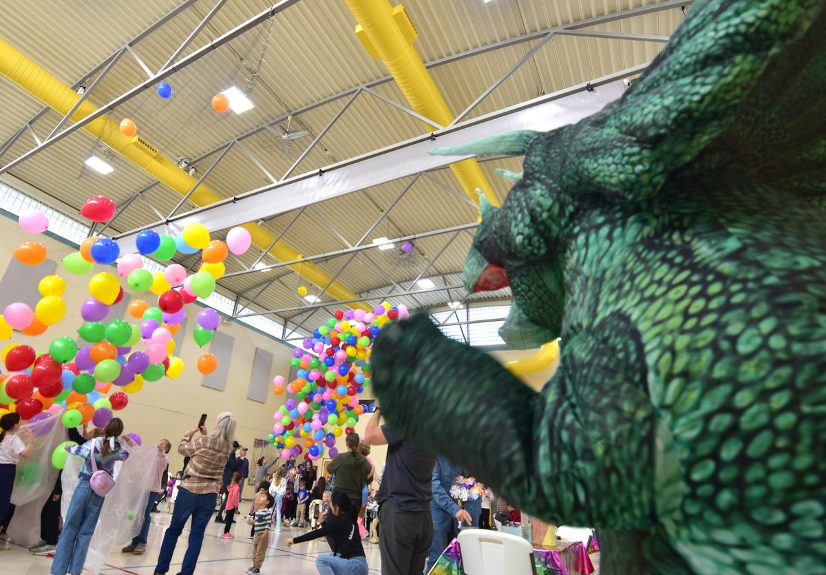 Where else but Solon would you find a T-Rex named "Trixie" pulling the cord for a Noon Year's Eve balloon drop? Trixie, and Solon Public Works Superintendent Kris Richardson had the honor of dropping over 500 balloons at noon for the Solon Public Library’s annual Noon Year’s Eve event Wednesday, Dec. 31 at the Solon Methodist Church’s Family Life Center.
