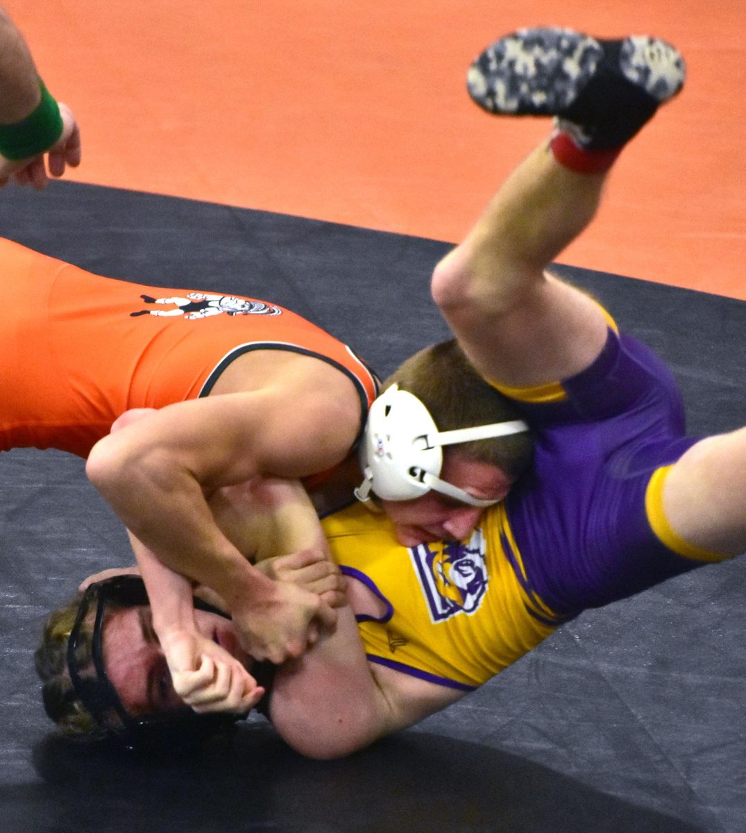 Grayson Waddell takes his shot against Central DeWitt’s Lane Johnston in the 120-lb. match. Waddell pinned Johnston in 2:39.`