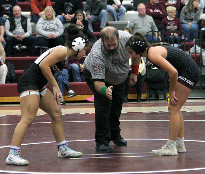 Layla Knazze faces off against Mount Vernon’s Carly Elliott for the 115 lb. match Thursday, Jan. 22 in Mount Vernon. Knazze won by 11-5 decision over Elliott.