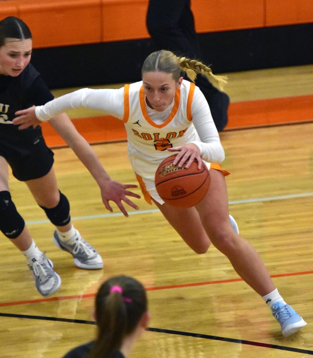 Delainey Durr drives in toward the basket Tuesday, Jan. 27 at home against the CPU Stormin’ Pointers. Durr, a senior, had 13 points on the night.