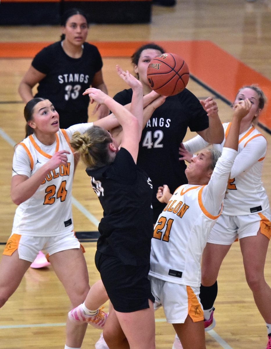 Jerzey Haluska (24), Laeni Hinkle (21) and Delainey Durr battle with a pair of Independence Mustangs for a rebound Friday, Feb. 6 at home. The Mustangs upset the Lady Spartans 54-51.