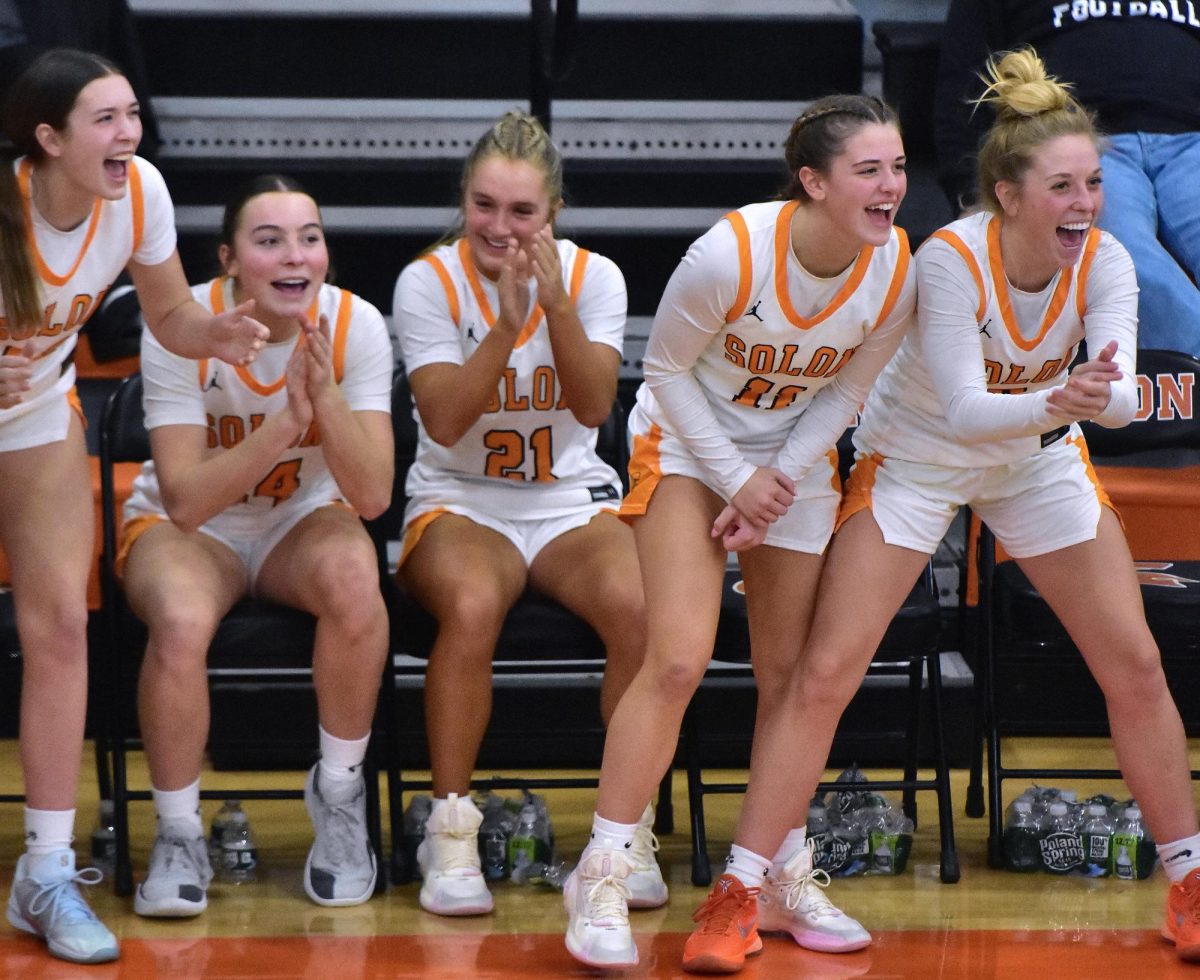 (From left) Kendyl Kidwell, Jerzey Haluska, Laeni Hinkle, Laney Johnson, and Delainey Durr celebrate a three-point basket by sophomore Avery Johnson Tuesday, Feb. 10 at home against Vinton-Shellsburg. The Lady Spartans crushed the Vikings 82-12 with eight points from Johnson including a pair of three-point baskets.