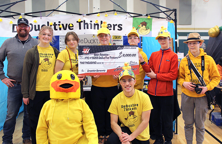 Representatives from the Gene Haas Foundation present Solon Robotics' Deducktive Thinkers with a $2,000 competition sponsorship check at the Machu Picchu Robotics League Tournament at Iowa City West High School on Saturday, Feb. 14.