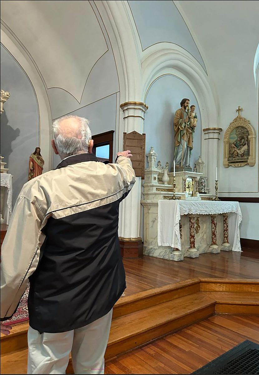 Bernie White points out intricate architectural details and a marble altar in Saints Peter and Paul Chapel on Taft Ave. NE near Solon. The former Catholic church now serves as a chapel for weddings and a space for events.