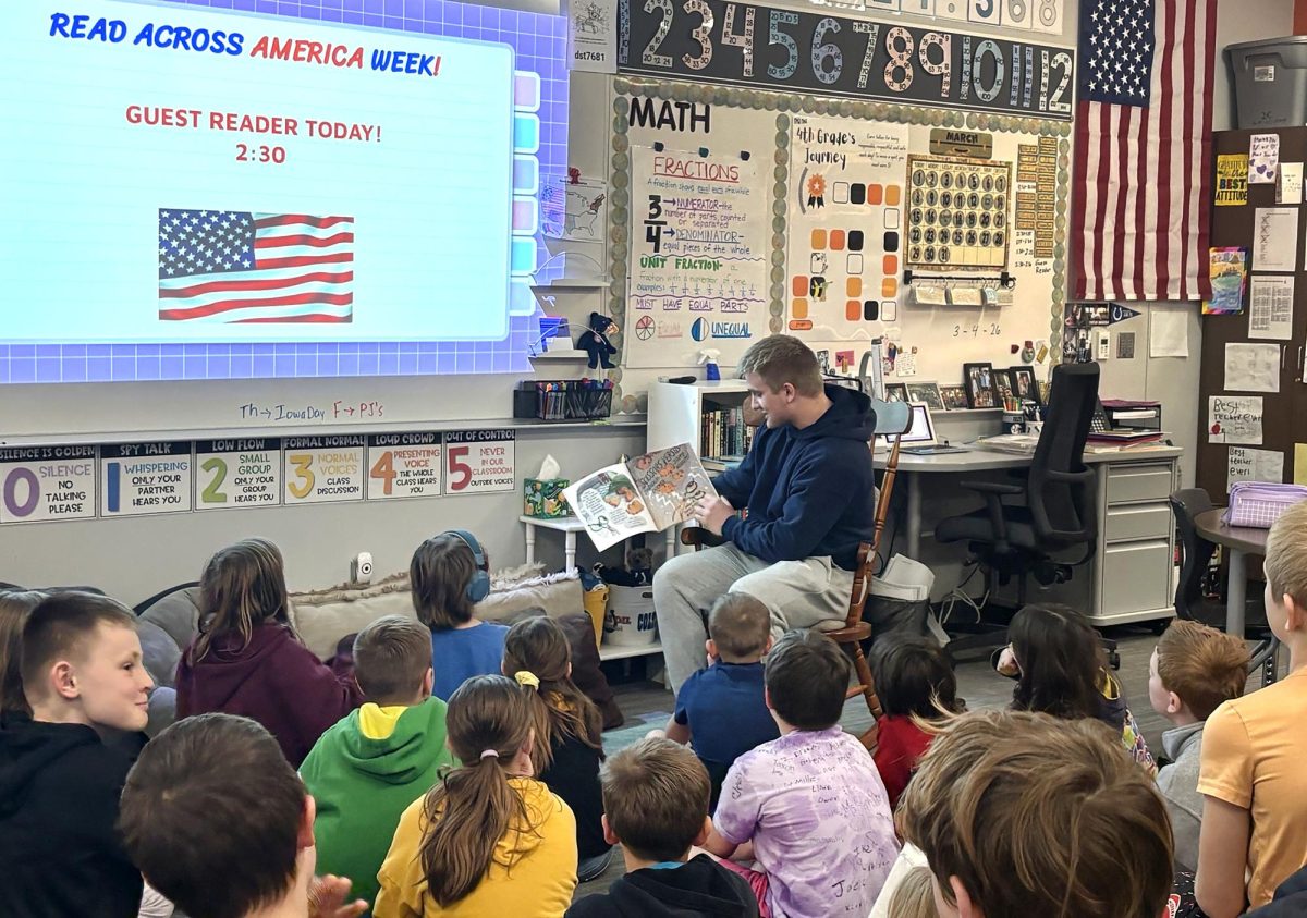Solon High School student Parker Beck guest reads in Mrs. Wheeler's fourth-grade classroom during last Wednesday’s special Read Across America event.