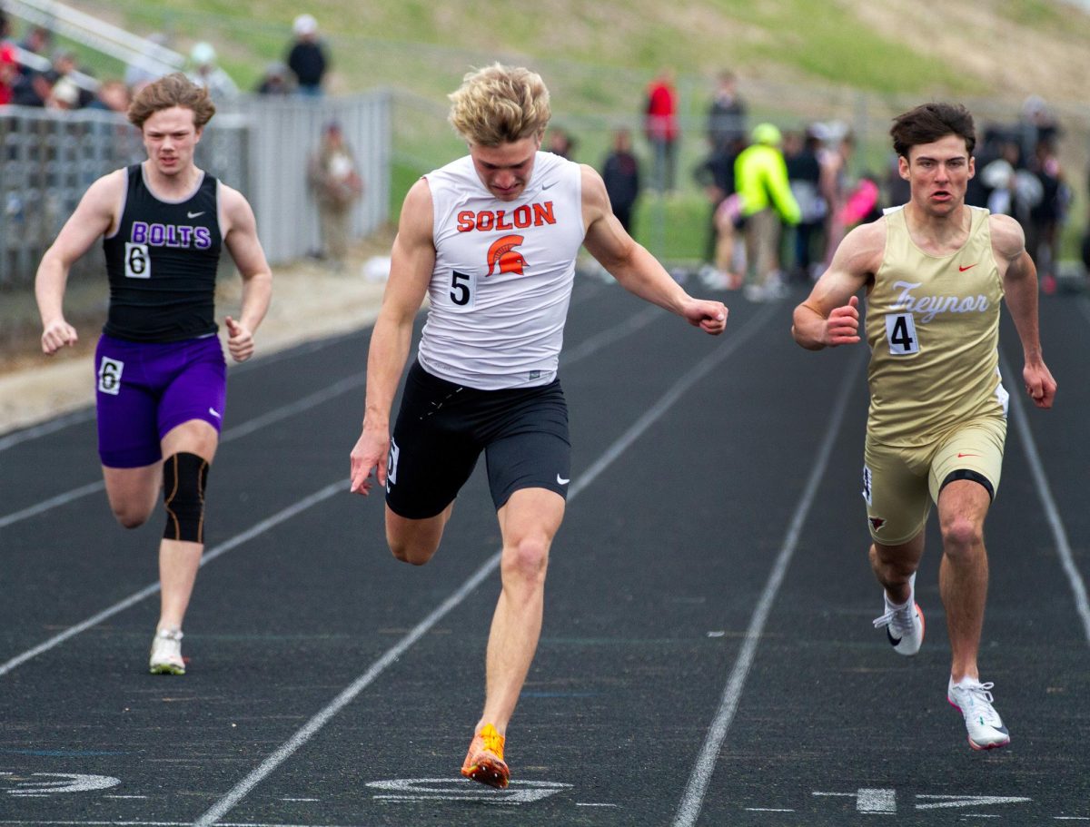 Eli Kampman (5) crosses the finish line in the Boys 100 meter dash at the 2026 Eastern Iowa Track & Field Festival at Iowa City West High School Saturday, April 11.