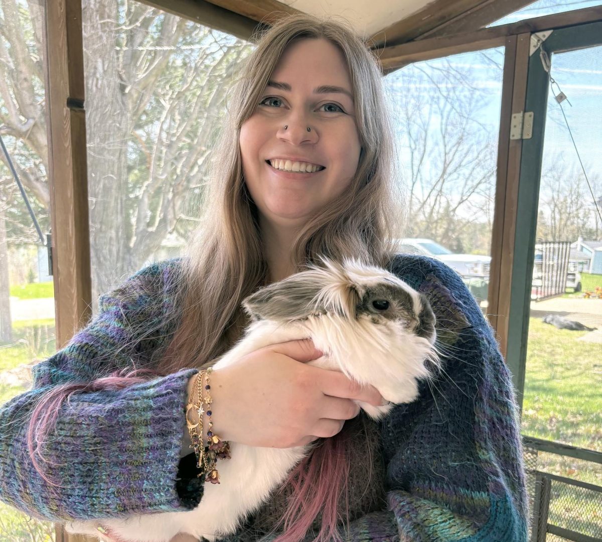 Amanda Messegee, founder of Lucky Clover Rabbit Rescue, holds rescue rabbit Laipti while standing on her porch in Solon. Messegee started the rescue after discovering an injured rabbit near her college, an effort that grew into a larger mission focused on rehabilitation, education and adoption.