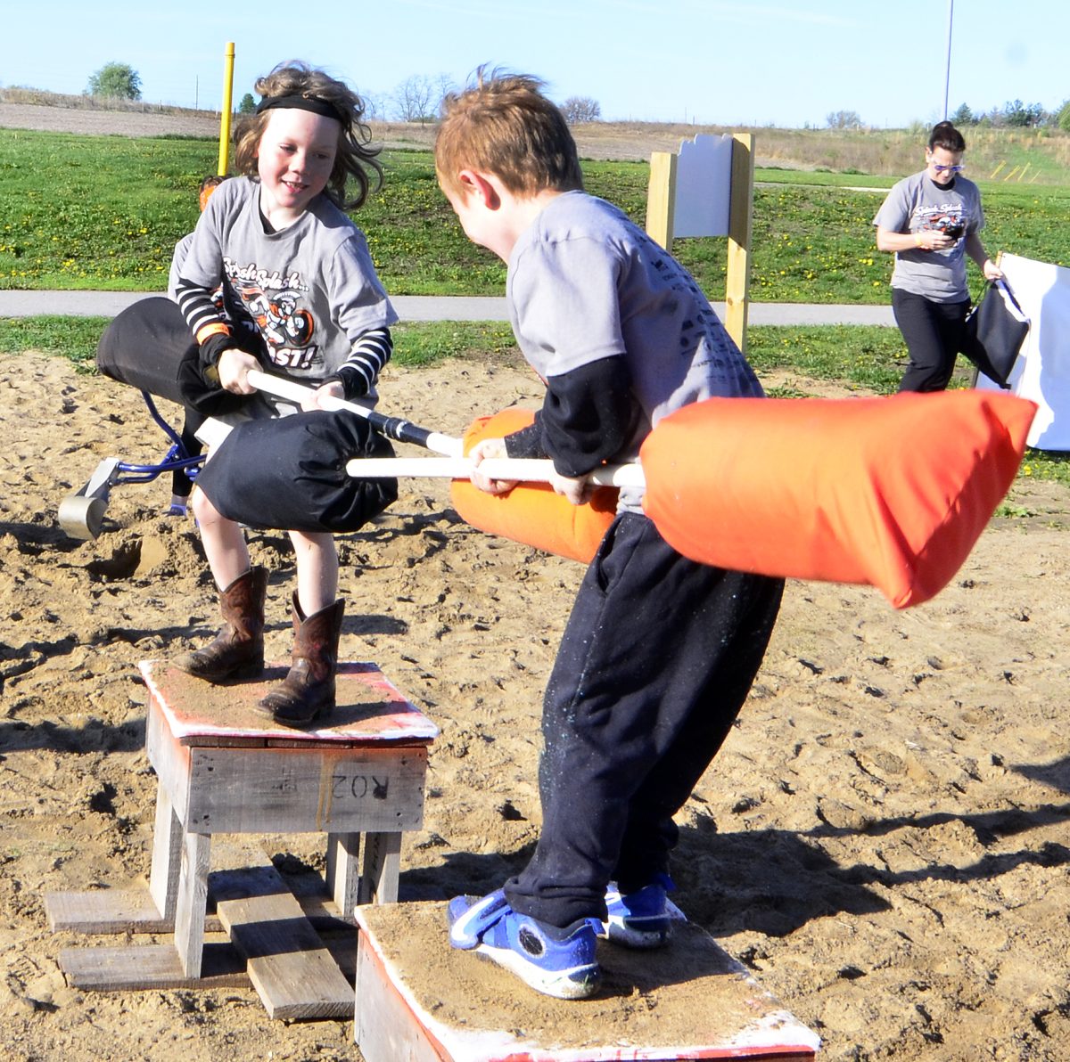 Barrett Logan and Eli Elsasser battle with pugil sticks during the 2026 Spartan Dash.
