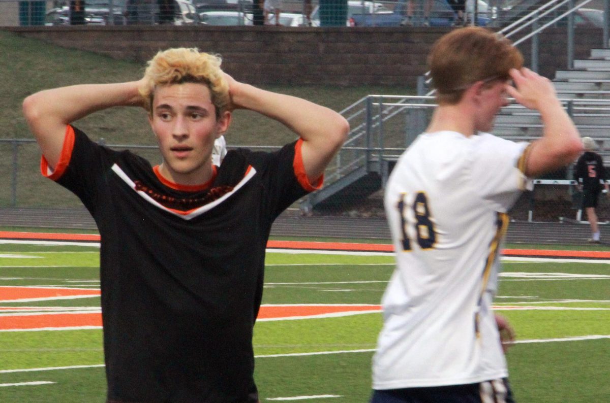 Senior Rene Meza (16) expresses shock after a play near the Solon goal goes awry Monday in the varsity boys’ season opener against Iowa City Regina Catholic. The Regals won the match 6-1.