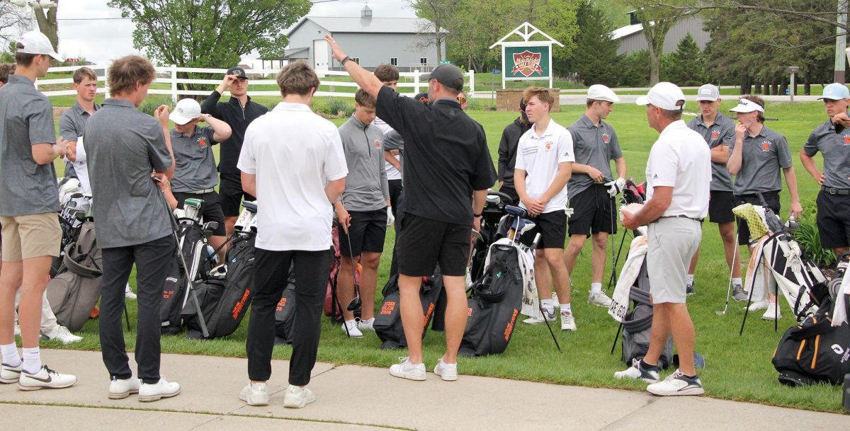 Head coach Adam Stahle delivers a final pre-meet address to his players emphasizing the mental composure that led the Spartans to a dominant 155-181 victory over Benton Community.