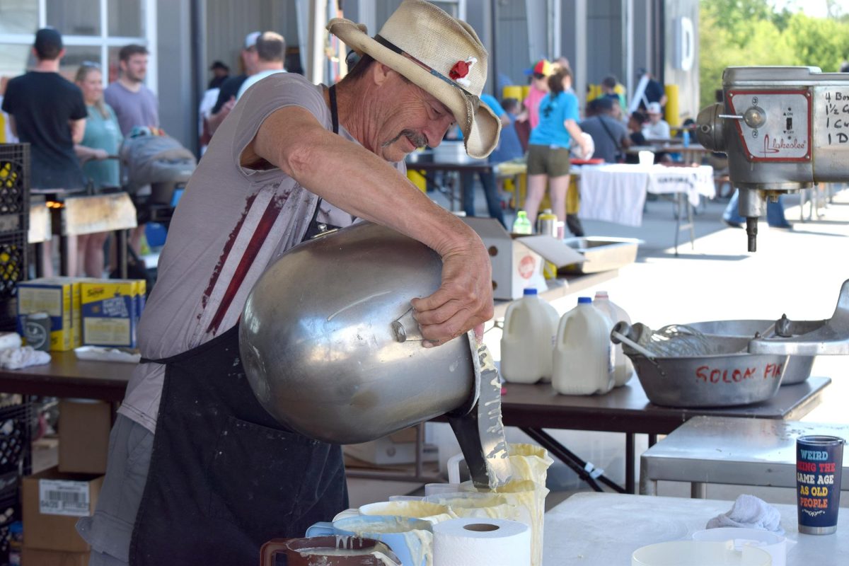 A volunteer pours pancake batter during the Solon Firefighters Association’s annual pancake breakfast Saturday in Solon. Community members gathered throughout the morning for pancakes, eggs, sausage and fellowship.