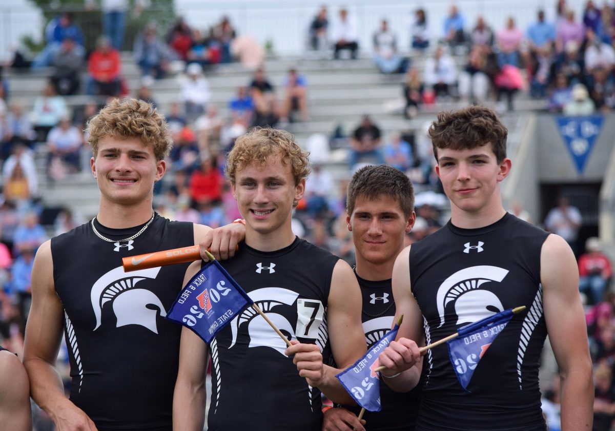 Solon Boys 1600m Sprint Medley members (from left) Eli Kampman, Mac Svalstad, Jackson Burk, Paxton Holtkamp pose together following their first place finish during the Iowa High School State Track and Field Championships Friday, May 22, at Drake Stadium in Des Moines.