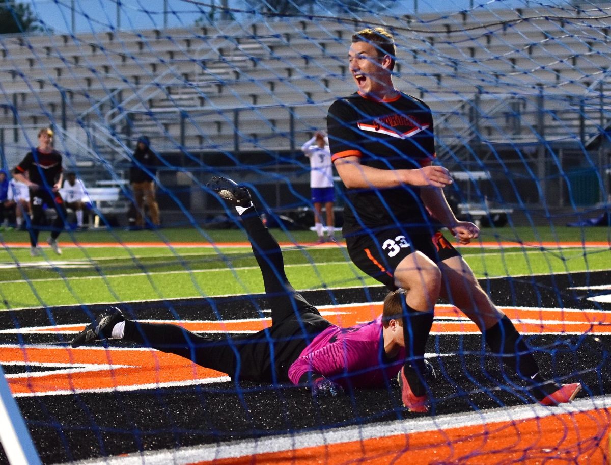 Ryan Locke celebrates his goal against Clear Creek Amana Thursday, April 30, at home.