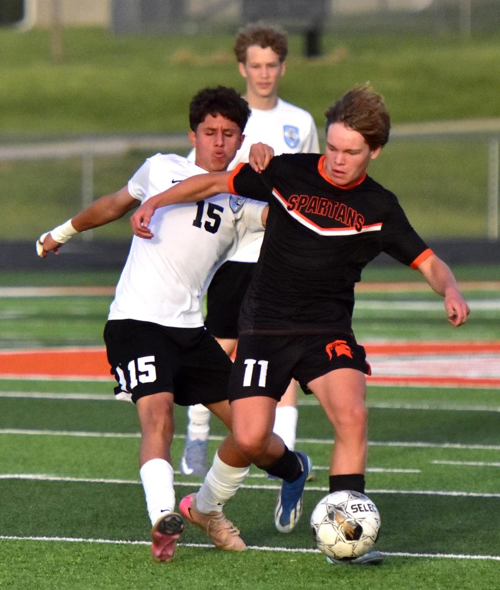 Caden Mai (11) battles South Tama’s Damian Garcia-Martinez Tuesday, May 12 in Solon. The Spartans reigned 8-0 over the Trojans on Senior Night.