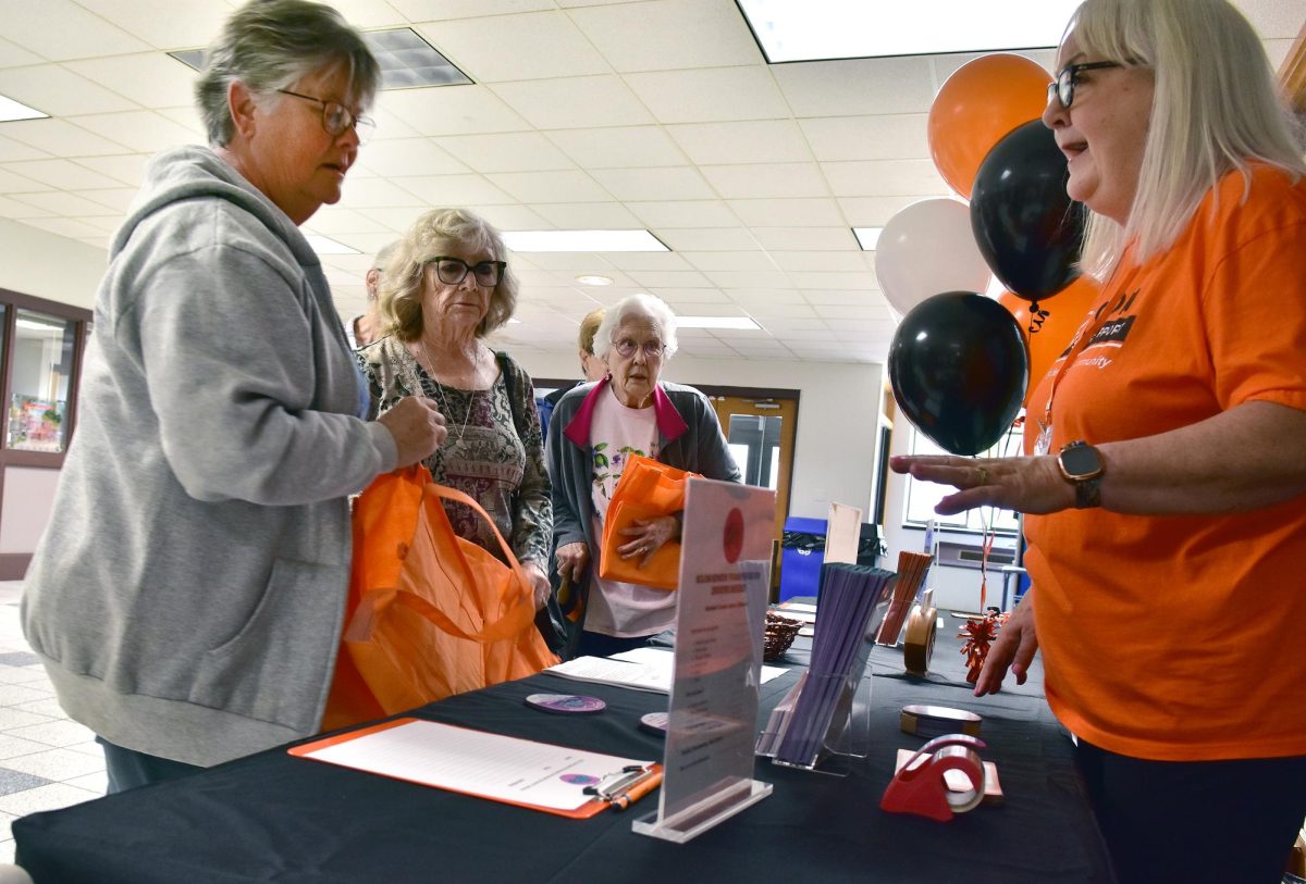 Cindy Jensen, Transportation Coordinator for Solon Senior Support (at right) explains how the free, all-volunteer transport service works during the first Solon Senior Expo Tuesday, May 19, at the Solon Community Center.