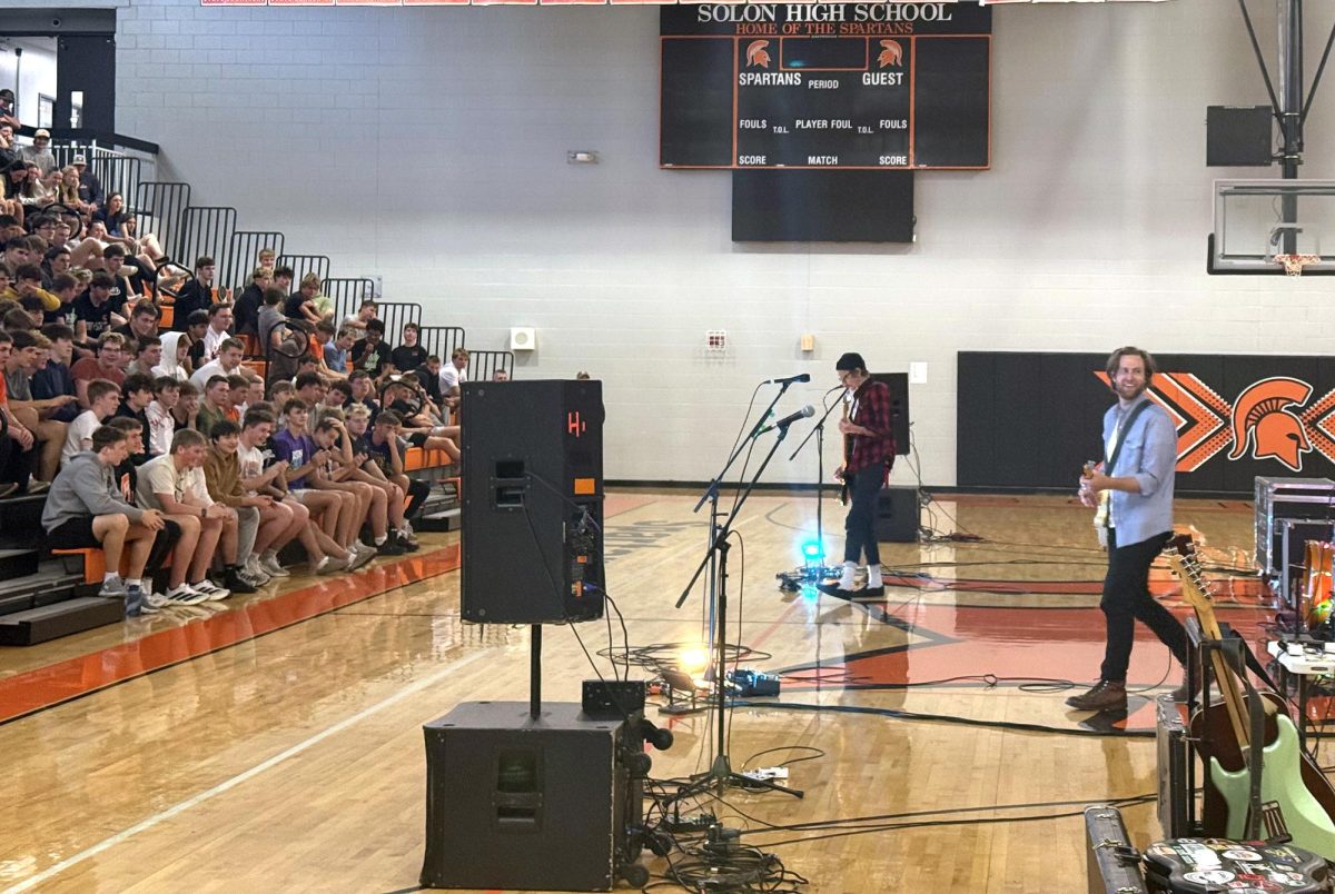 Carter Hulsey and band rock the stage for Solon High School students at the Finance Your Future concert on Tuesday, April 21. Funding the Future's financial literacy program teaches budgeting, credit, and money management through music, storytelling, and engaging visuals.