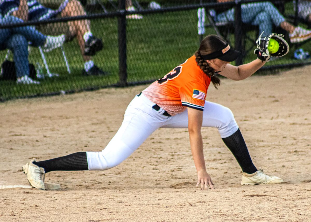 Beckett Kruse stretches to make the out at first against Center Point-Urbana in Center Point on Wednesday, June 24.