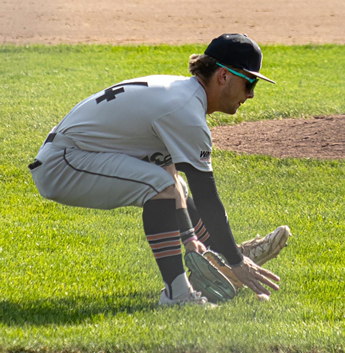 Hayden Detra fields a hit up the third base line against Center Point-Urbana in Center point on
Thursday, June 25.