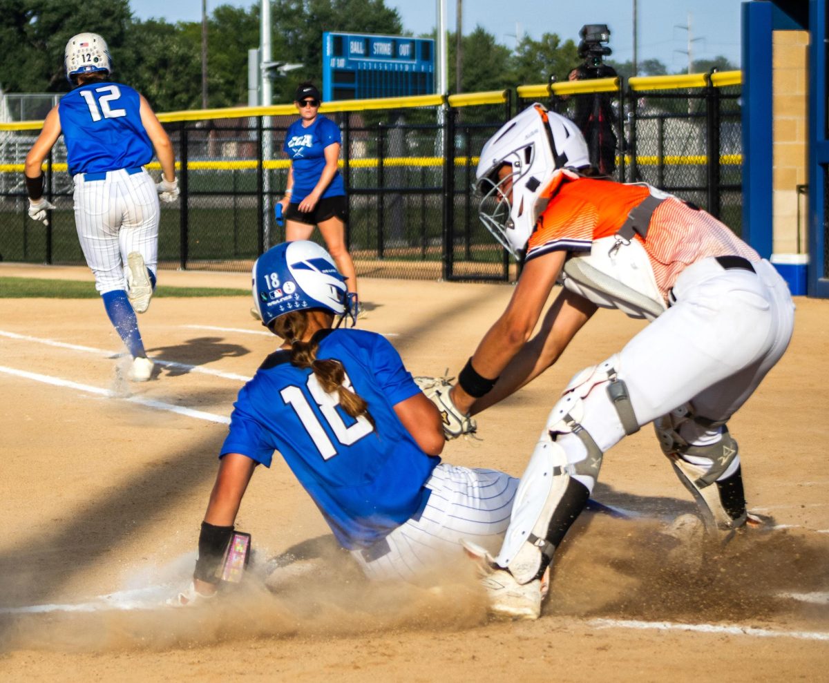 Catcher Chloe Madura gets Clear Creek Amana’s Elizabeth Timmerman out at home plate in the first inning during the second game in a varsity double header between the Solon Lady Spartans and the Clear Creek Amana Clippers at CCA Athletic Complex in Tiffin on Wednesday, July 1, 2026. The Spartans beat the Clippers, 7-5.