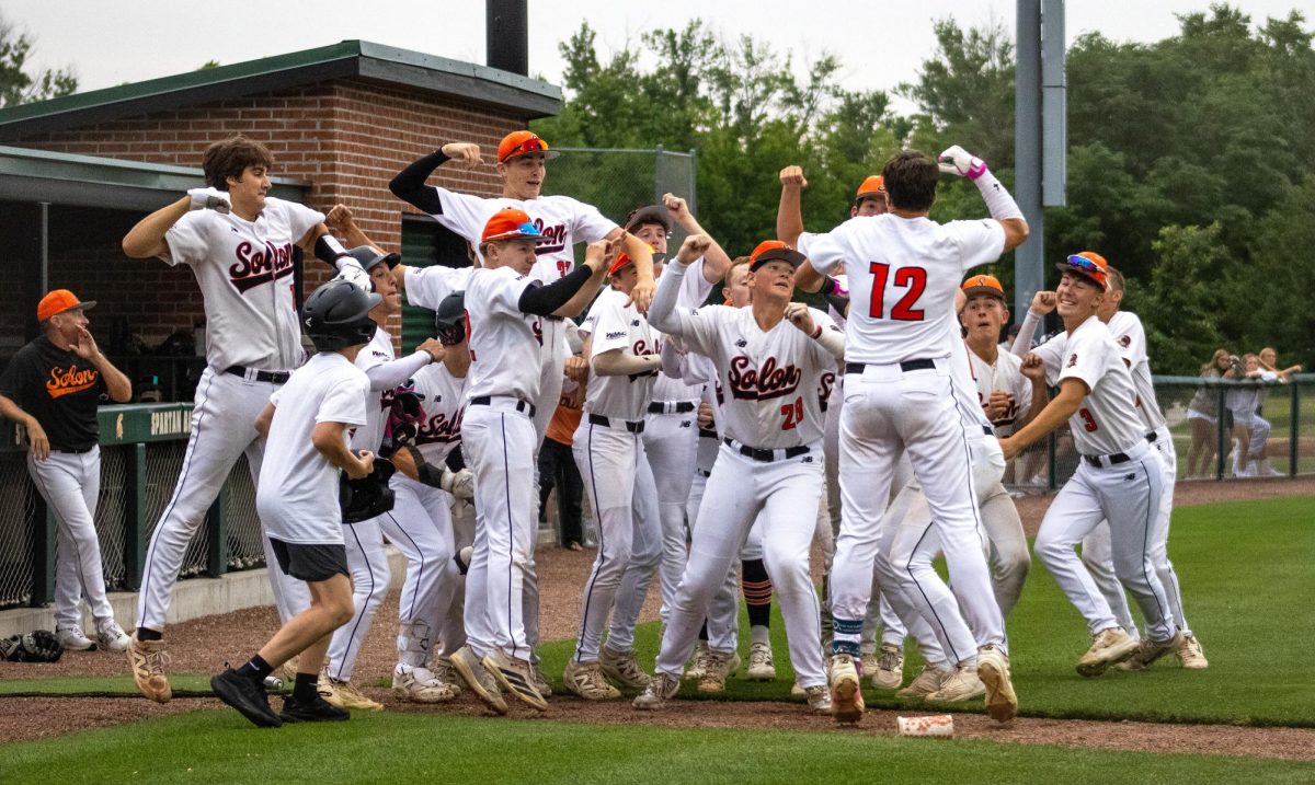 Luke Merrick celebrates with his teammates after hitting a home run in the second inning of an IHSAA 3A Substate 5 quarterfinals game between the Solon Spartans and the Keokuk Chiefs at Solon High School Baseball Field on Friday, July 10. The Spartans beat the Chiefs 7-0 to advance to the semifinals against Williamsburg Monday, July 13
