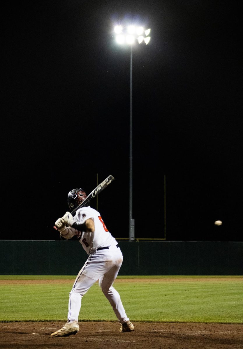 Solon catcher Carson Kidwell prepares to bat the ball in the seventh inning during an IHSAA 3A Substate 5 Championship match between the Solon Spartans and the Assumption Knights at Solon High School Baseball Field on Wednesday, July 15, 2026. The Knights beat the Spartans, 12-4.